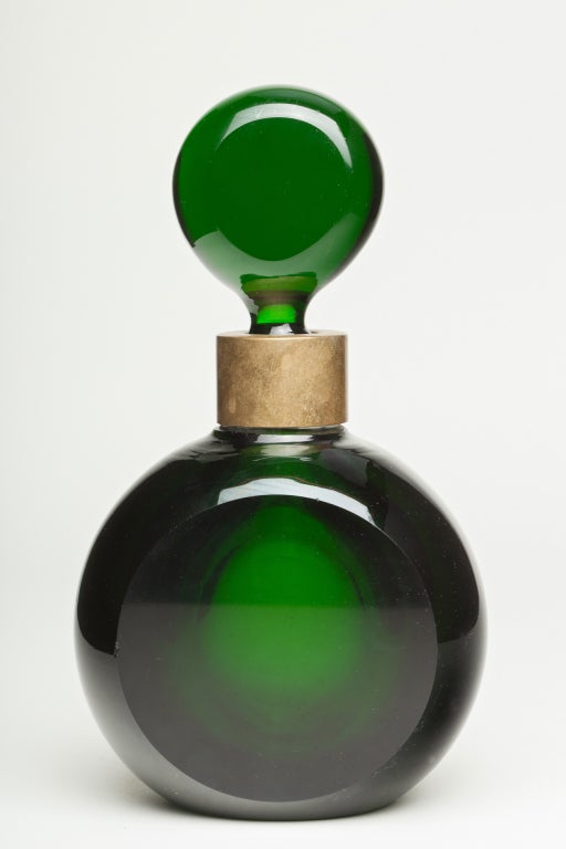 From Paris come these rare and extraordinary large pair of green perfume bottles with stoppers circa 1920's. Stunning!