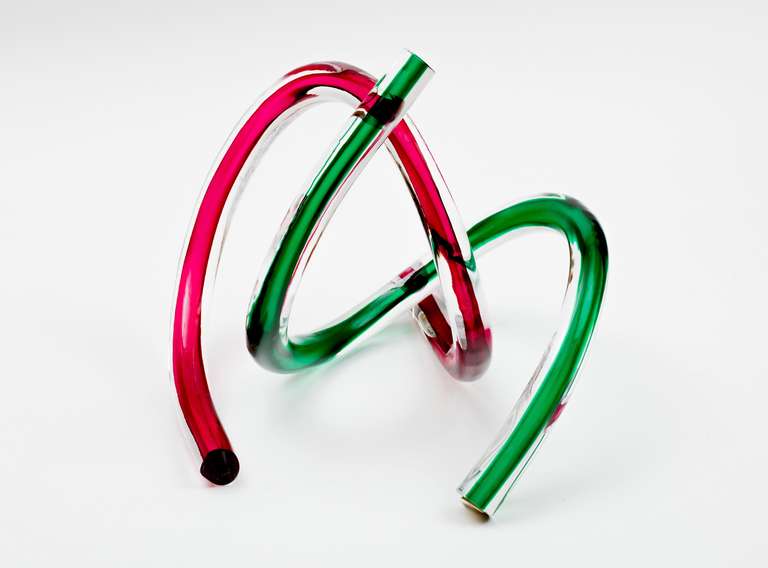 A luscious pair of red and green loop de loop Murano glass sculptures that can be entwined to create many dramatic looks.  Fabulous pieces! Unsigned.