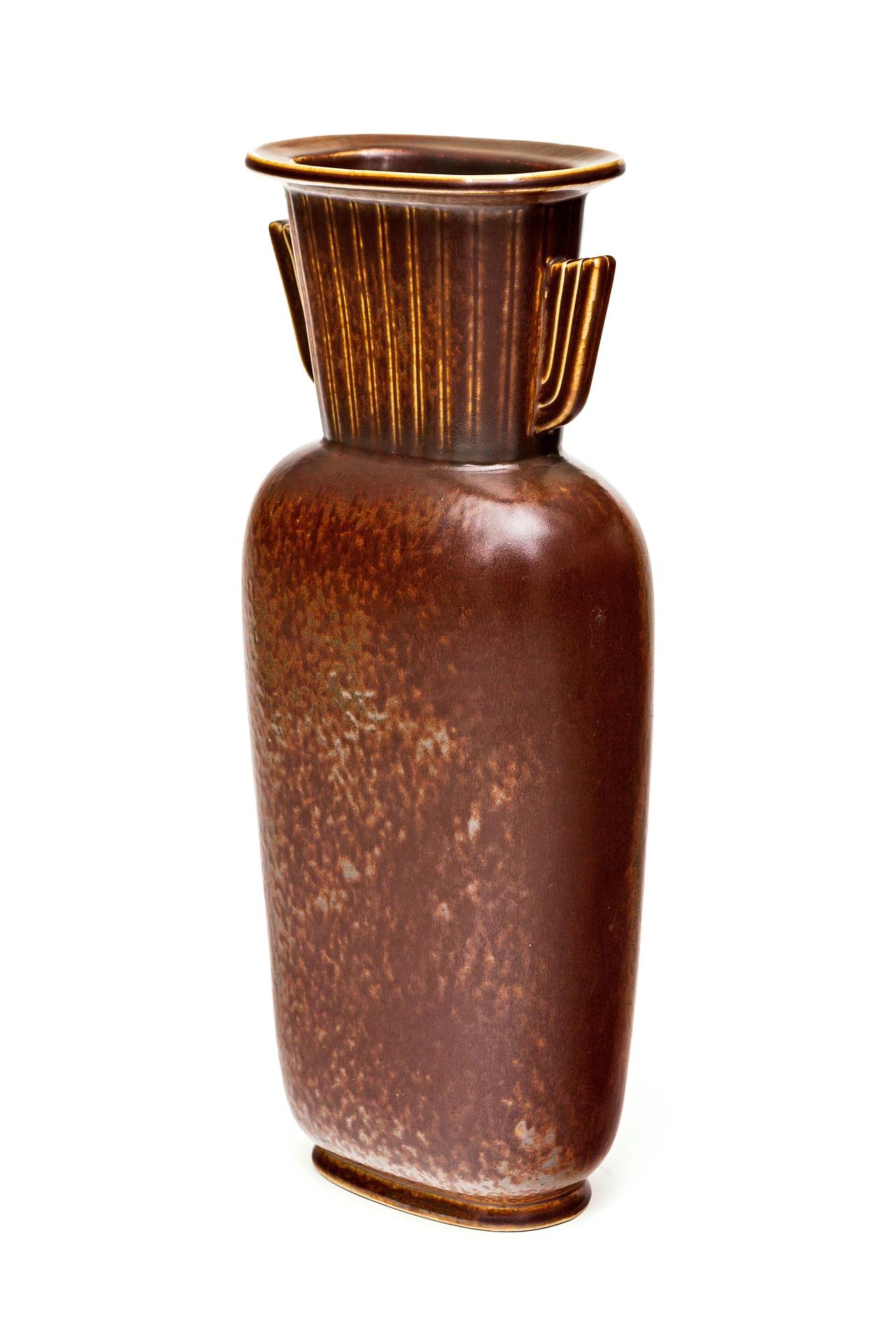 Fabulous and rare Gunnar Nylund for Rörstrand vase in mottled chocolate brown and copper glaze. 

Nylund worked for Rorstrand from 1931–1955, where the majority of the time he served as the artistic director. To this day, Nylund is considered one of