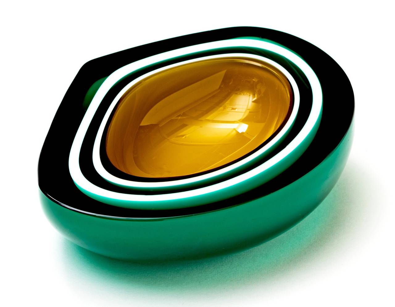 Stunning Asymmetrical Murano Geode Bowl with striking pattern of alternating dark green and white layers with luscious gold glass center.

Please note camera lights and equipment reflect onto the glass.
