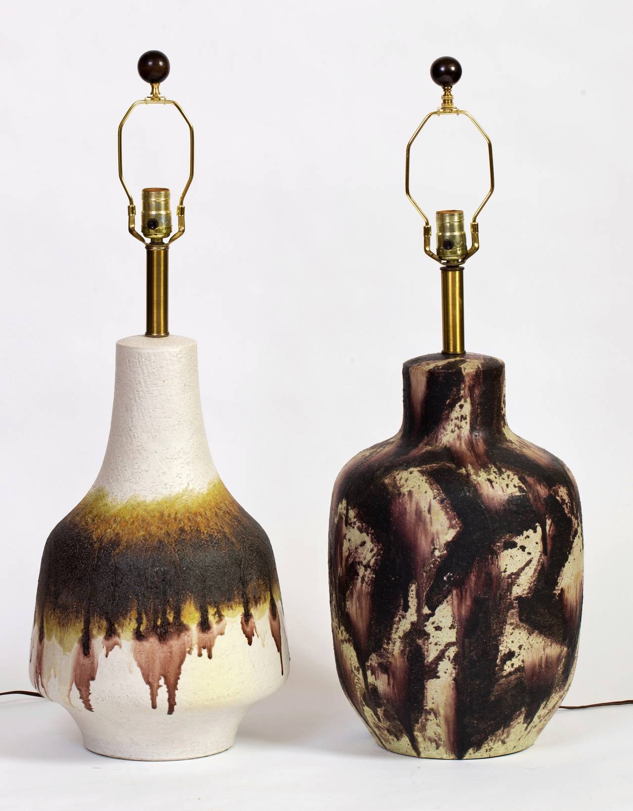 Unique pair of mismatched Fantoni ceramic pottery lamps for Raymor. Beautiful scale and design from the layered drips to the abstract pattern. The off white lamp is signed, Fantoni, Italy for Raymor, the other unsigned. 

Each lamp is 31 inches high