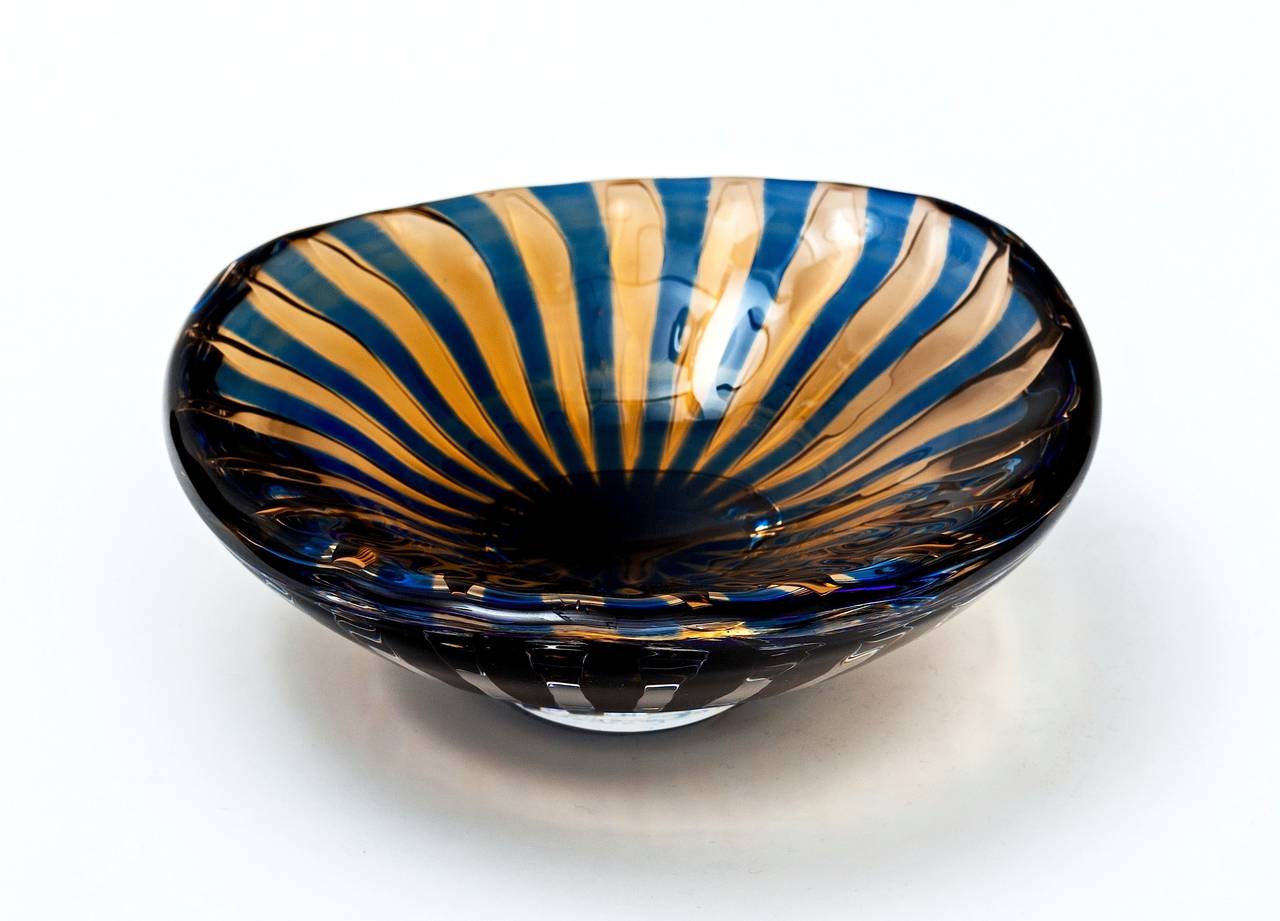 Asymmetrical Orrefors Ariel Bowl by Edvin Öhrström circa 1950's.  Extremely heavy and solid piece with alternating blue and gold in the ariel technique.  Signed, Orrefors Ariel 1714 Edvin Öhrström.