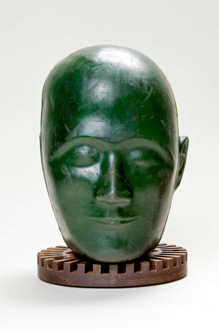 Eye Catching Vintage Crash Test Dummy Head circa 1960's on top of an industrial gear base.  Made from heavy dark green rubber he's the perfect 