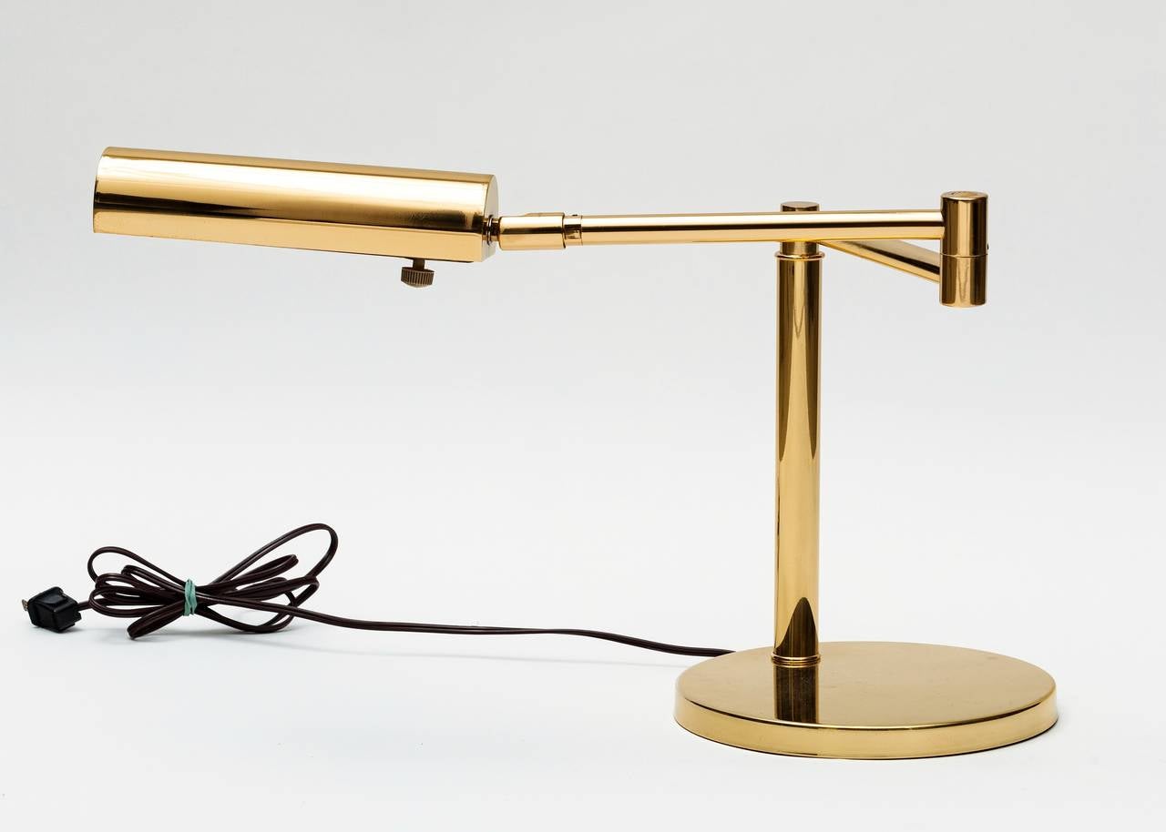 Great Looking Koch and Lowy Table Lamp in brass with weighted base and adjustable arm and shade circa 1970's which can be positioned in a variety of ways.  Rewired and polished.  Signed.