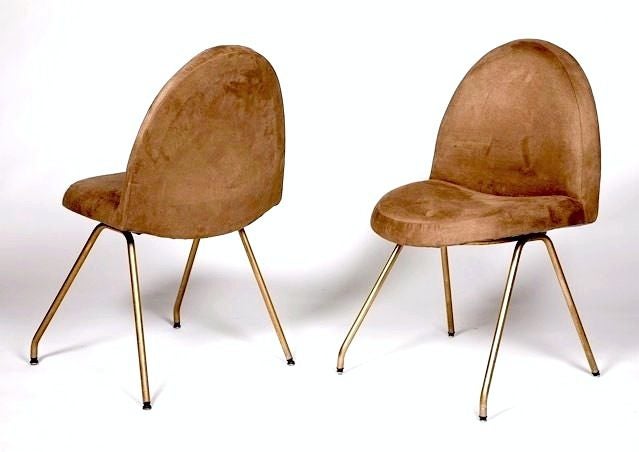 Early pair of Joseph-Andre Motte 771 chairs covered in taupe faux suede with enameled metal tubular feet. Has original Steiner labels on bottom of chairs. Great period French post war chairs.
