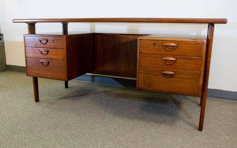 Executive size Danish teak desk designed by Kai Kristiansen. Very nice 