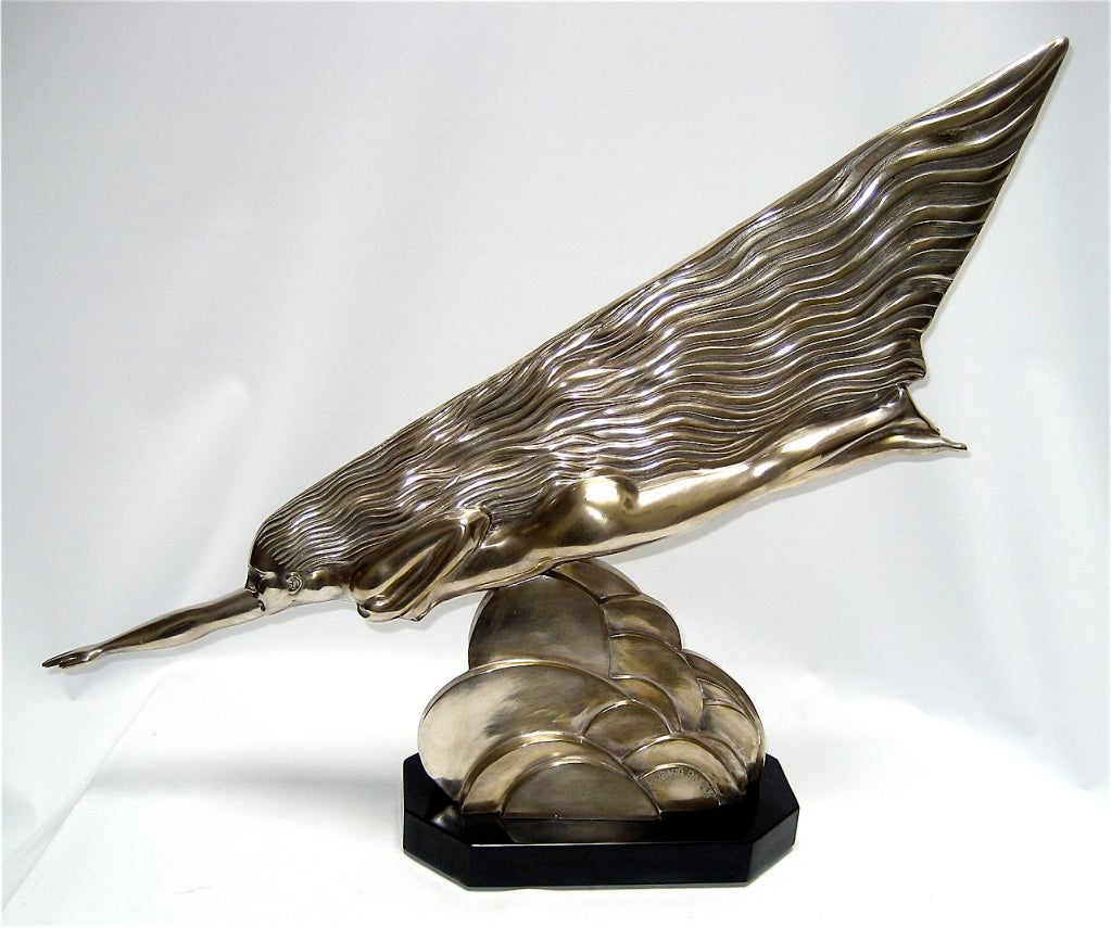 Silvered bronze comet. The bronze is signed 