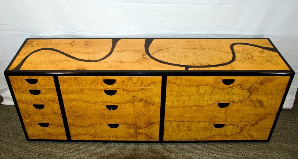 Mid century Olive burl dresser with ebony accents. Unusual organic inlay design on dresser top. Oak drawer interiors, 