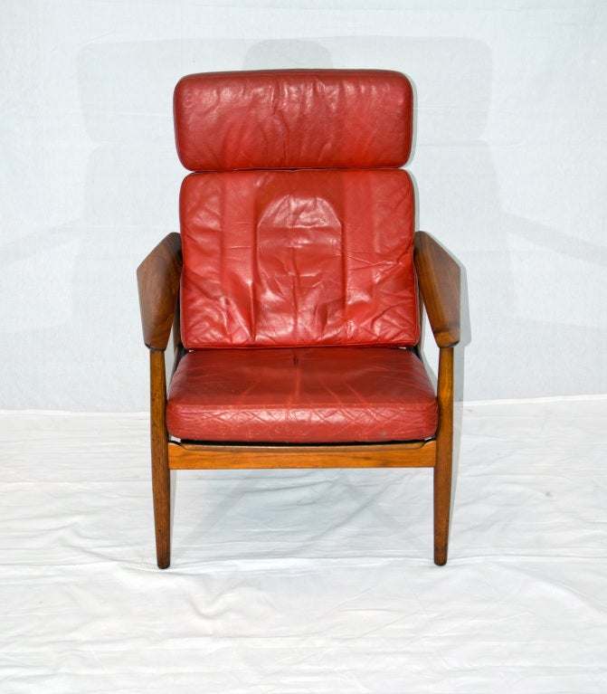 Nice mid century high back lounge chair with two reclining positions includes original ottoman. Has early incised France & Daverkosen mark on stretcher as well as the circular France & Sons tag. Features wide armrests typical of Arne Vodder design.