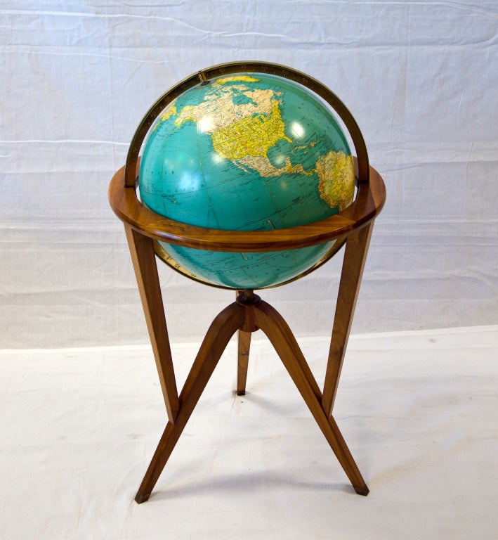 Indexed terrestrial Rand McNally globe in walnut stand. Designed by Edward Wormley for Dunbar. Light bulb accessed through bottom of globe.