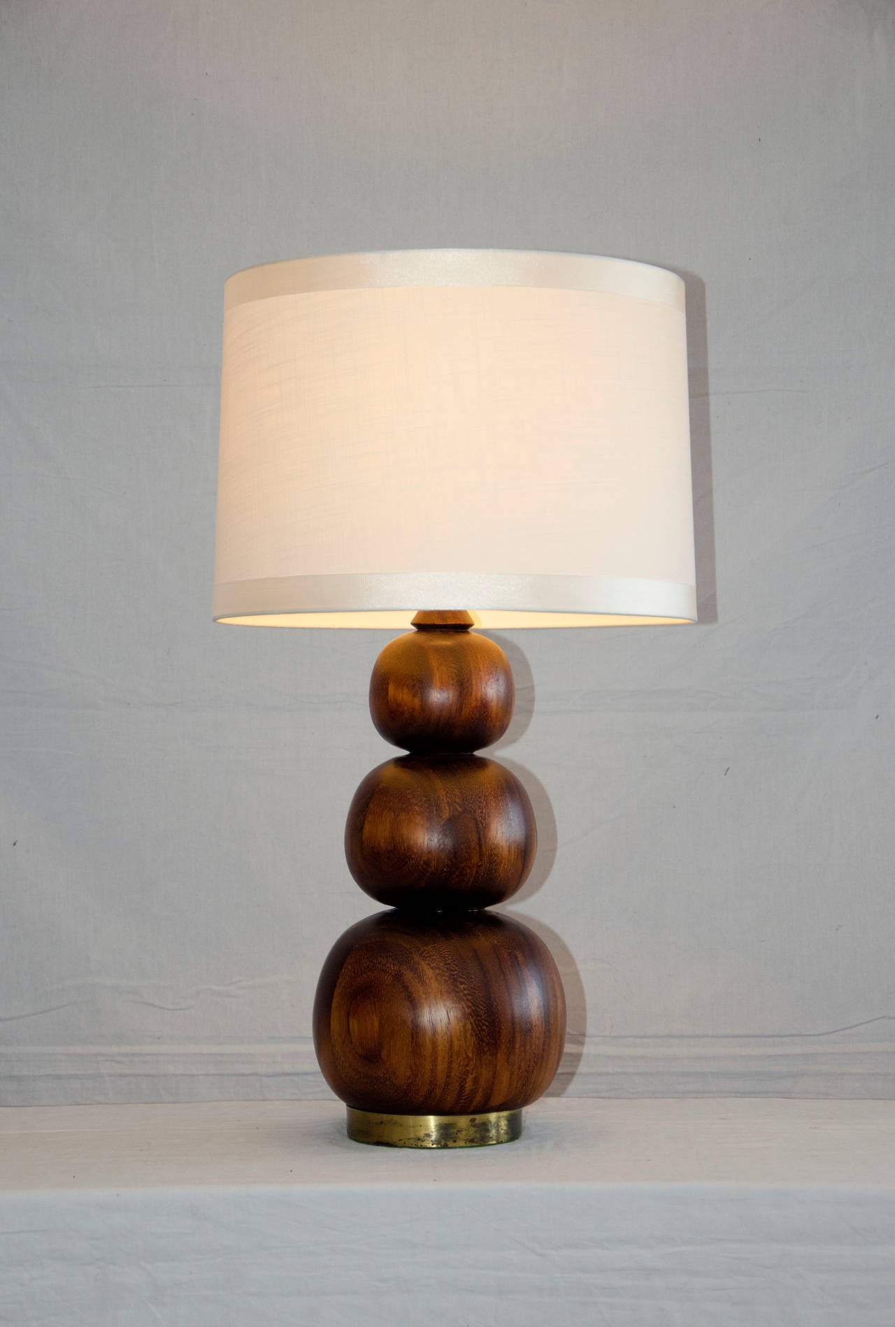 Unusual walnut lamp base consisting of three graduated size wood balls  attached to a 1