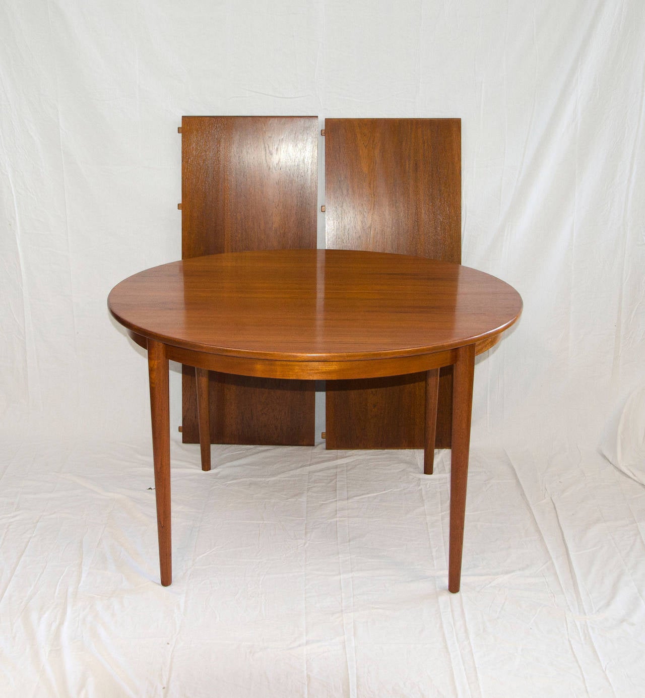 20th Century Danish Round Teak Dining Table with Two Leaves by Moreddi