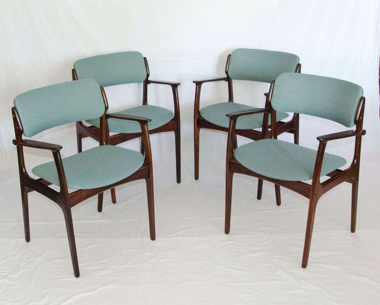 Stylish set of four rosewood armchairs designed by Erik Buck, O.D. Mobler tags on each chair.