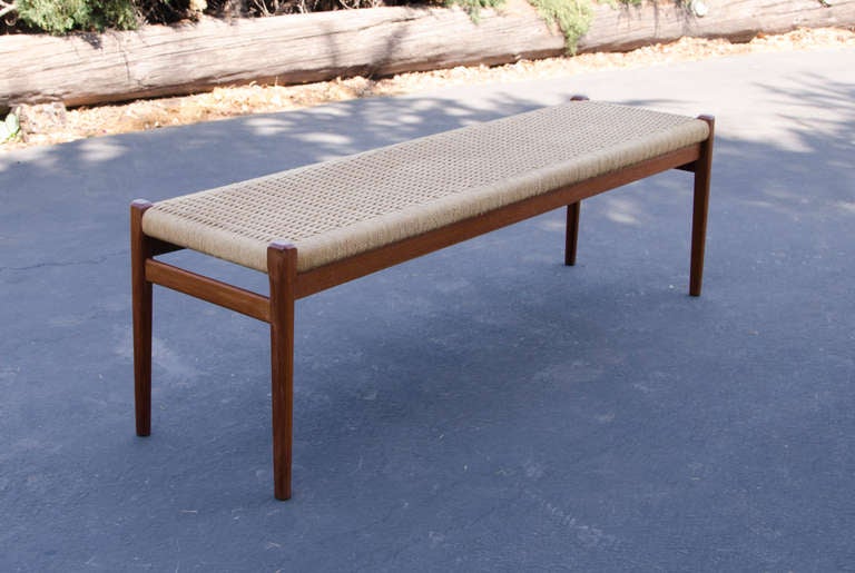 Rare bench can comfortably seat 2 or 3 people at the dining table or would be very useful in an entryway or at the foot of a bed. Bench has two metal support rods to distribute weight (see pictures).