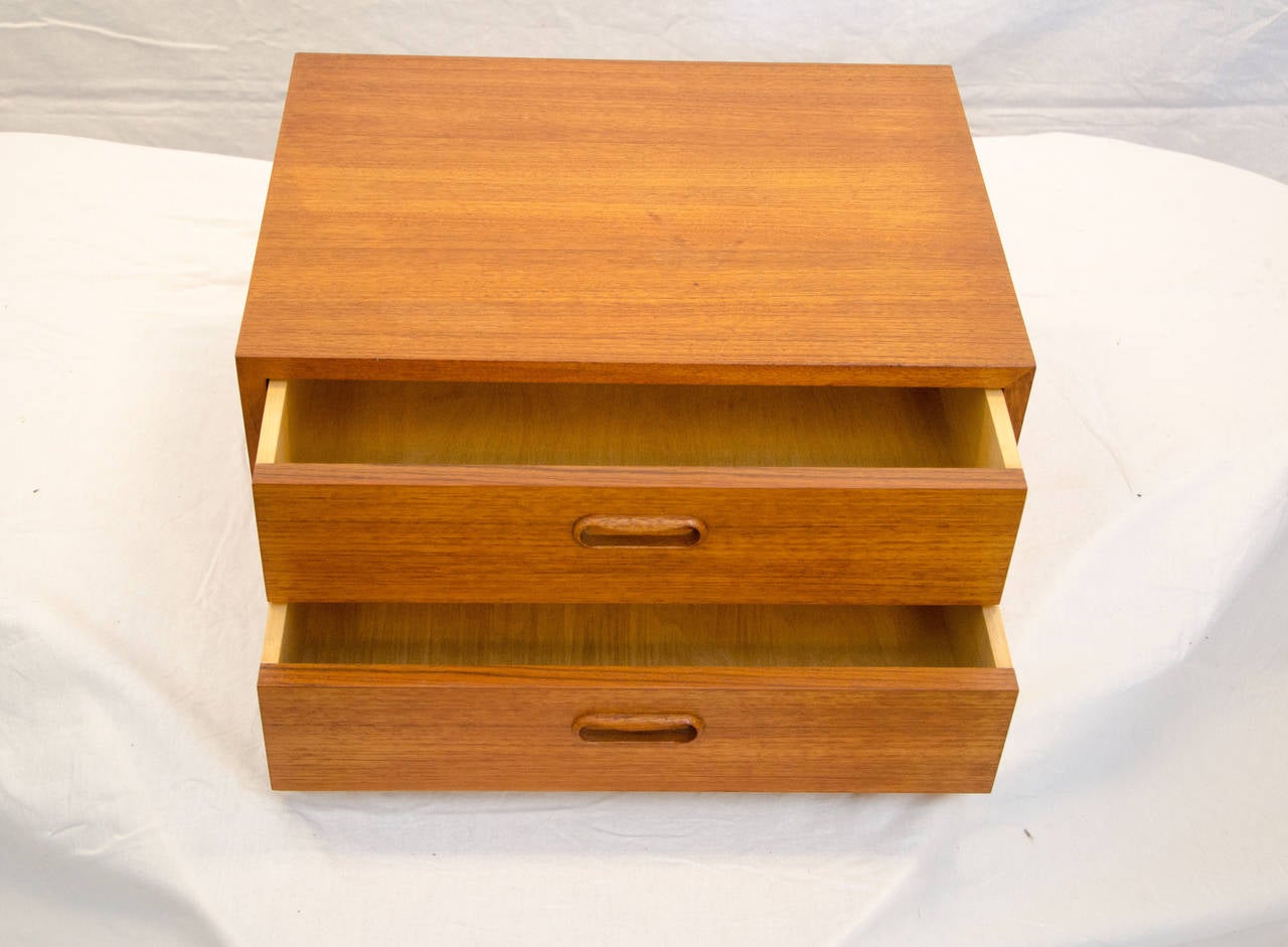 Small Danish two drawer cabinet for use as a jewelry cabinet on top of a dresser, drawers can be lined, would also serve well as a desk top or credenza storage cabinet. The cabinet was originally manufactured to fit on Bruksbo Mellamstrands benches.
