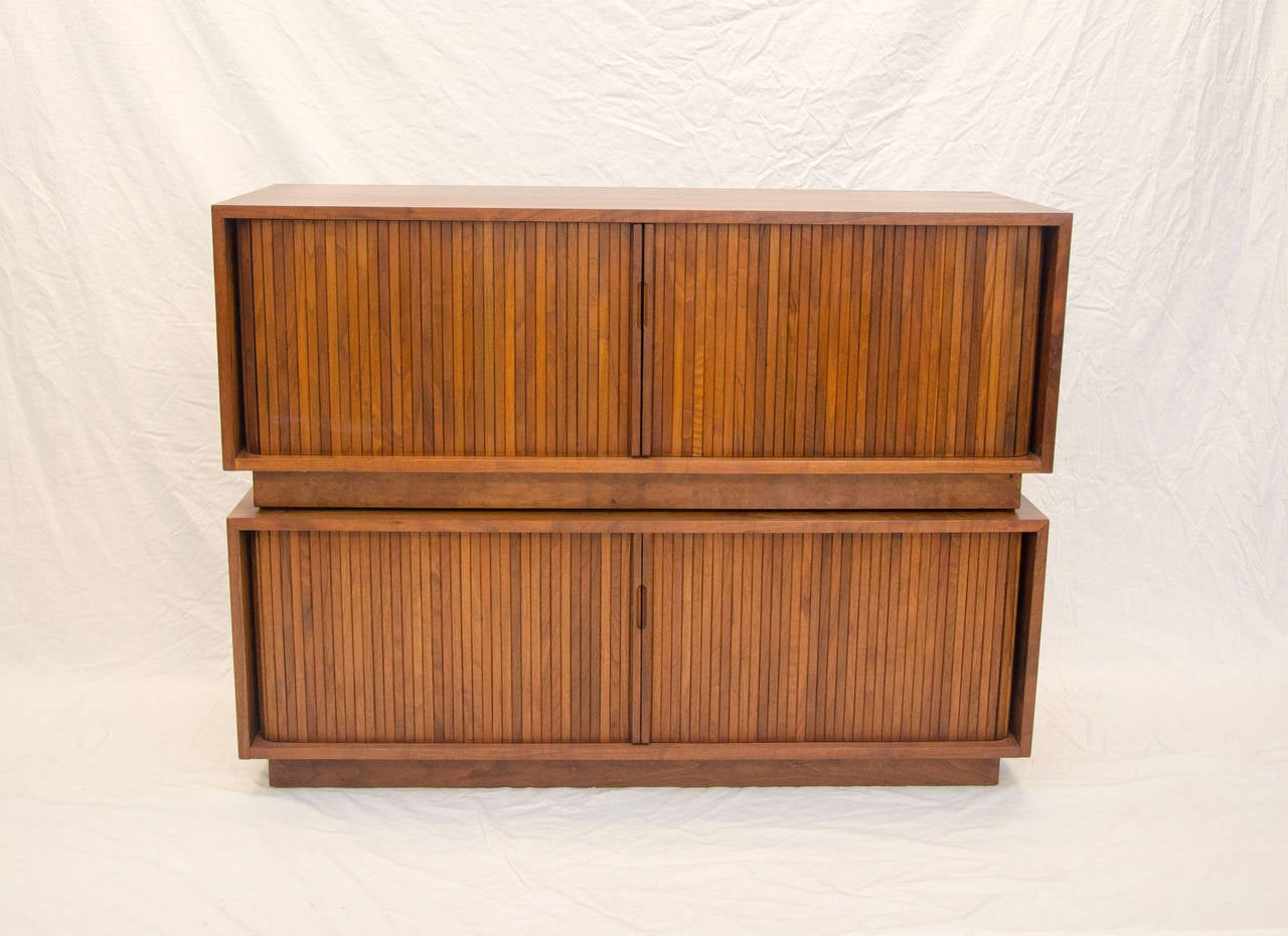 Nice pair of low credenzas with tambour doors and dividers for record storage could also be a low credenza for a flat screen, a bench under a window, or at the foot of a bed (with cushions custom made). Tambour doors allow access to the entire