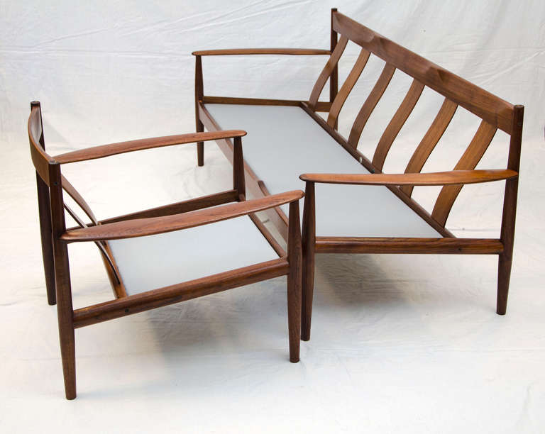 Good design sofa and matching chair set by Grete Jalk for France & Sons and imported from Denmark by John Stuart, NY. Retains all original tags on both pieces. Nicely sculpted wood frames with curved teak back slats. Pleasant to see from all