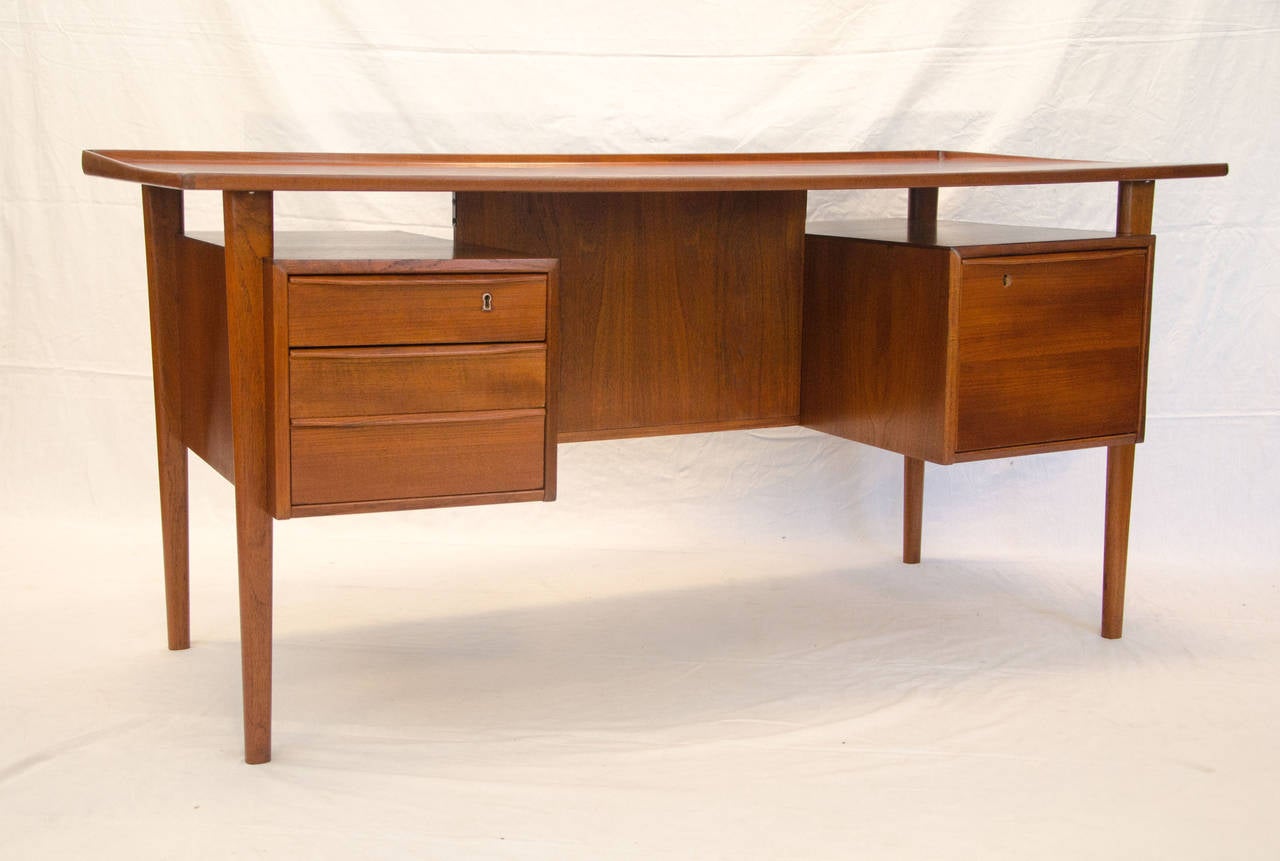 Very nice large Danish teak desk with lots of great features. The desk top 