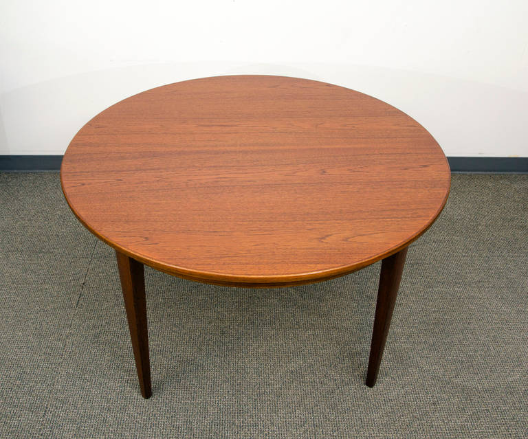 Midcentury Round Teak Dining Table with Three Leaves by Omann Jun In Excellent Condition In Crockett, CA