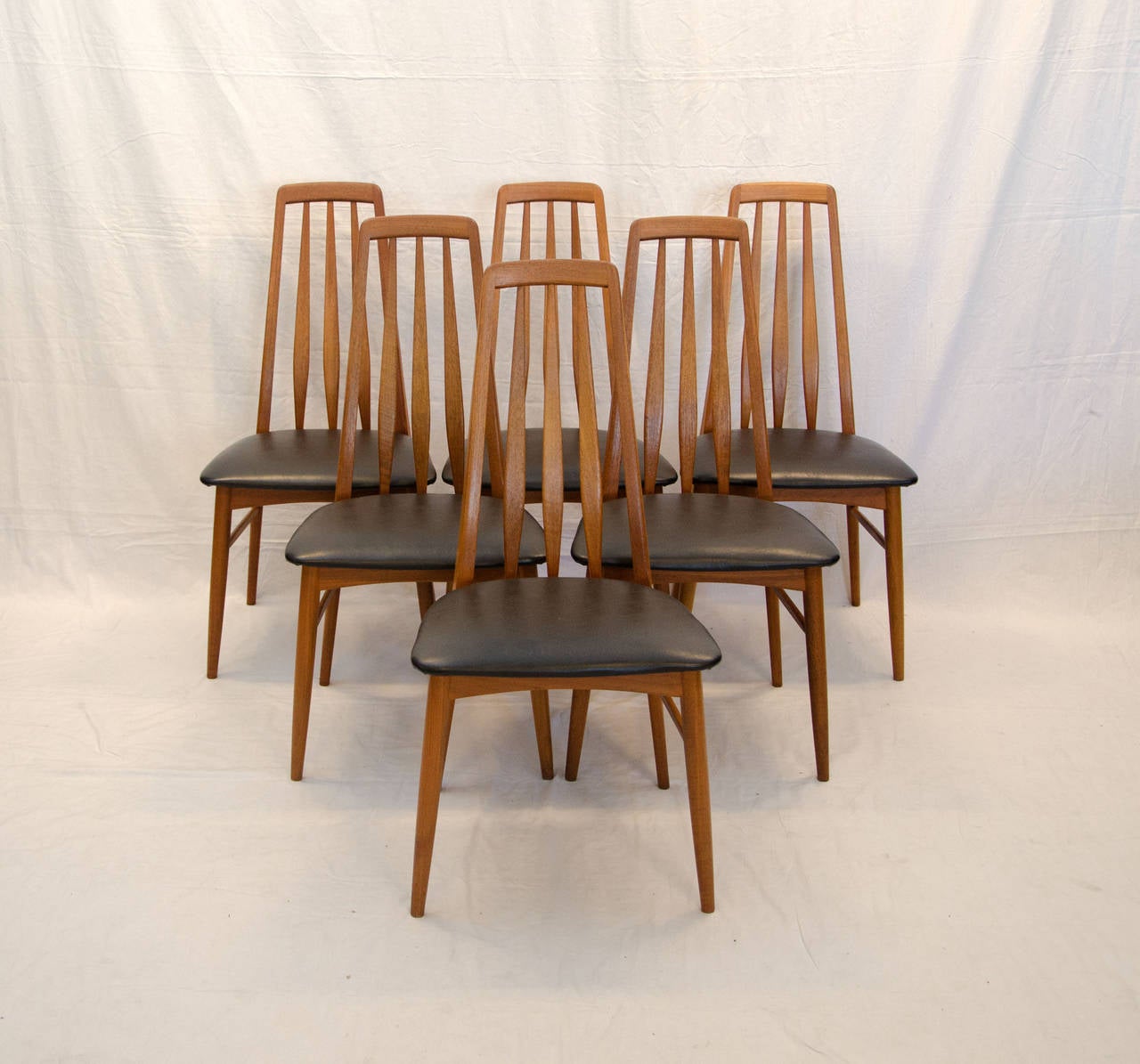 These very nice taller back dining chairs have just enough back to make them feel very comfortable. Named 