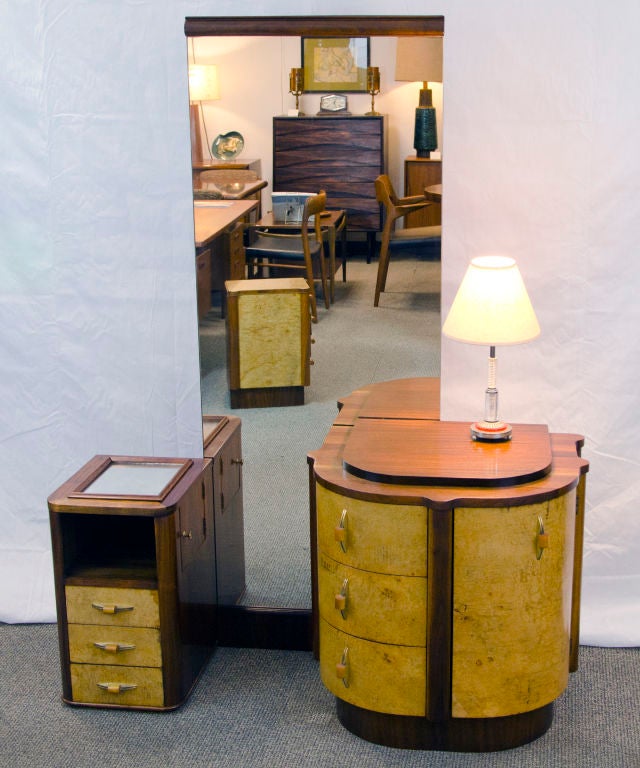 Nice smaller Art Deco bedroom set, includes a vanity with full length mirror, Hi-boy chest, and a Nightstand.  Vanity can be placed by the side of the bed to act as both another nightstand and a full length mirror.<br />
Dimensions:<br />
 Vanity: