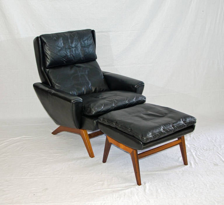 Very comfortable high back lounge chair with matching ottoman. Chair back has some cant to it for extra lounging feature. The headrest cushion is attached with Velcro strips to keep it in place. Rosewood frame and legs on the chair and ottoman.