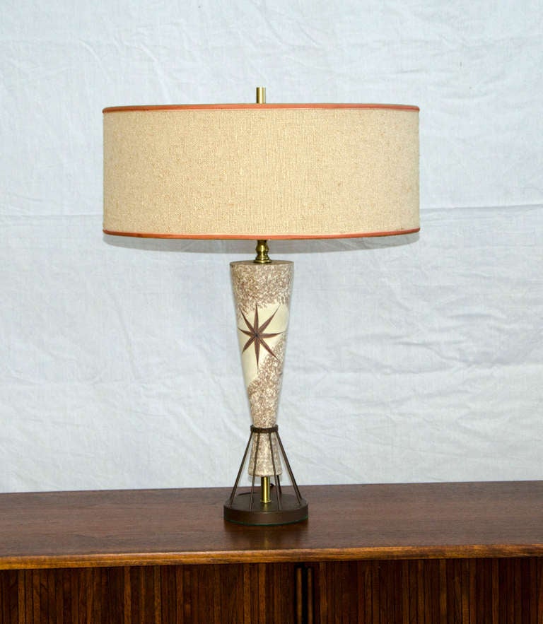 Whimsical vintage 1950's table lamp in the style of Marc Bellaire but unsigned. Original fabric shade has a salmon color band decorating the top and bottom. A milk glass diffuser supports the shade, brown metal base supports the ceramic part of the