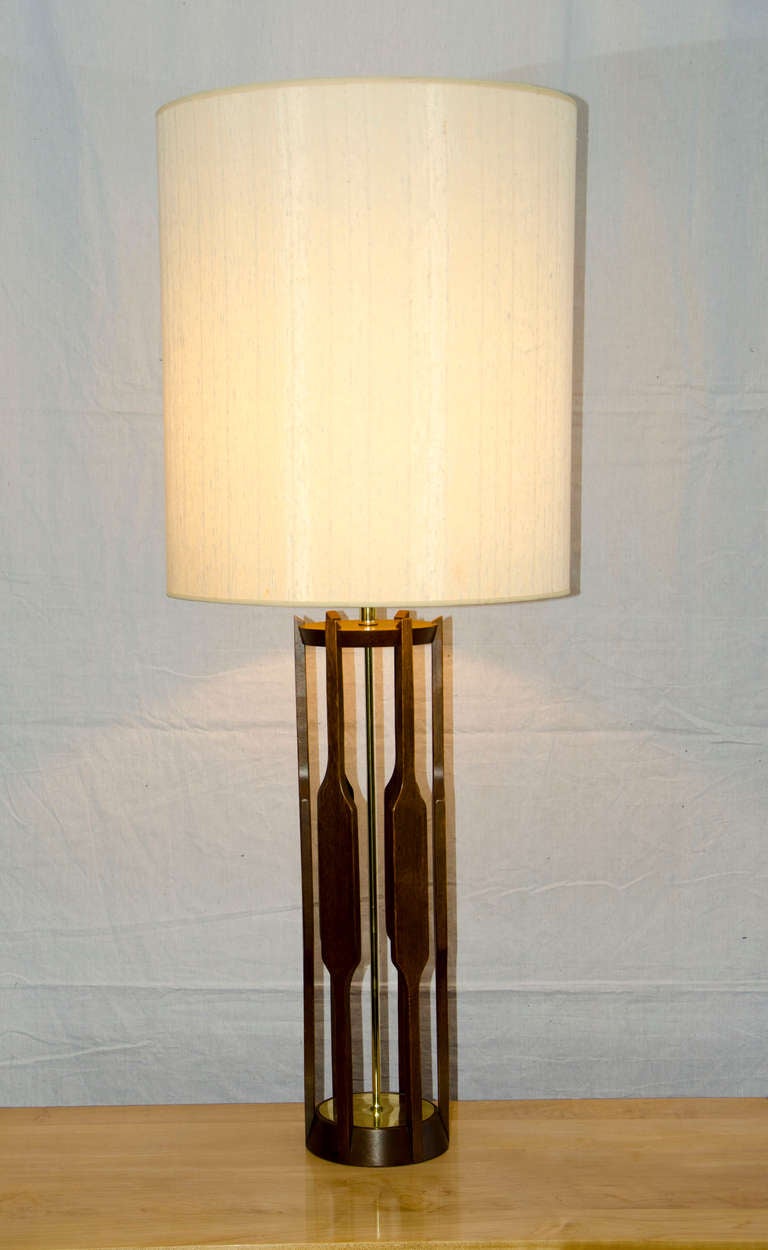 Sculpted wood frame and original nubby fabric shade. Retains Modeline Company tag. Brass accents. Shade is 17