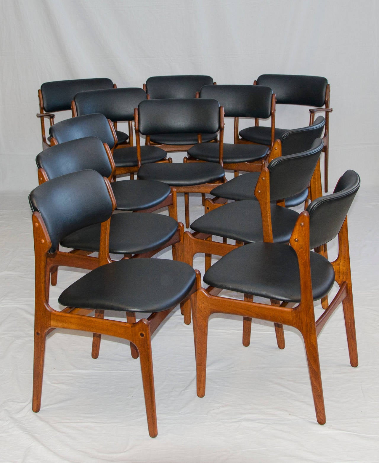 Large set of stylish Danish teak dining chairs designed by Erik Buck for O. D. Mobler.A favorite chair for the comfort aspect, well designed and constructed.
Side chair dimensions are: 31