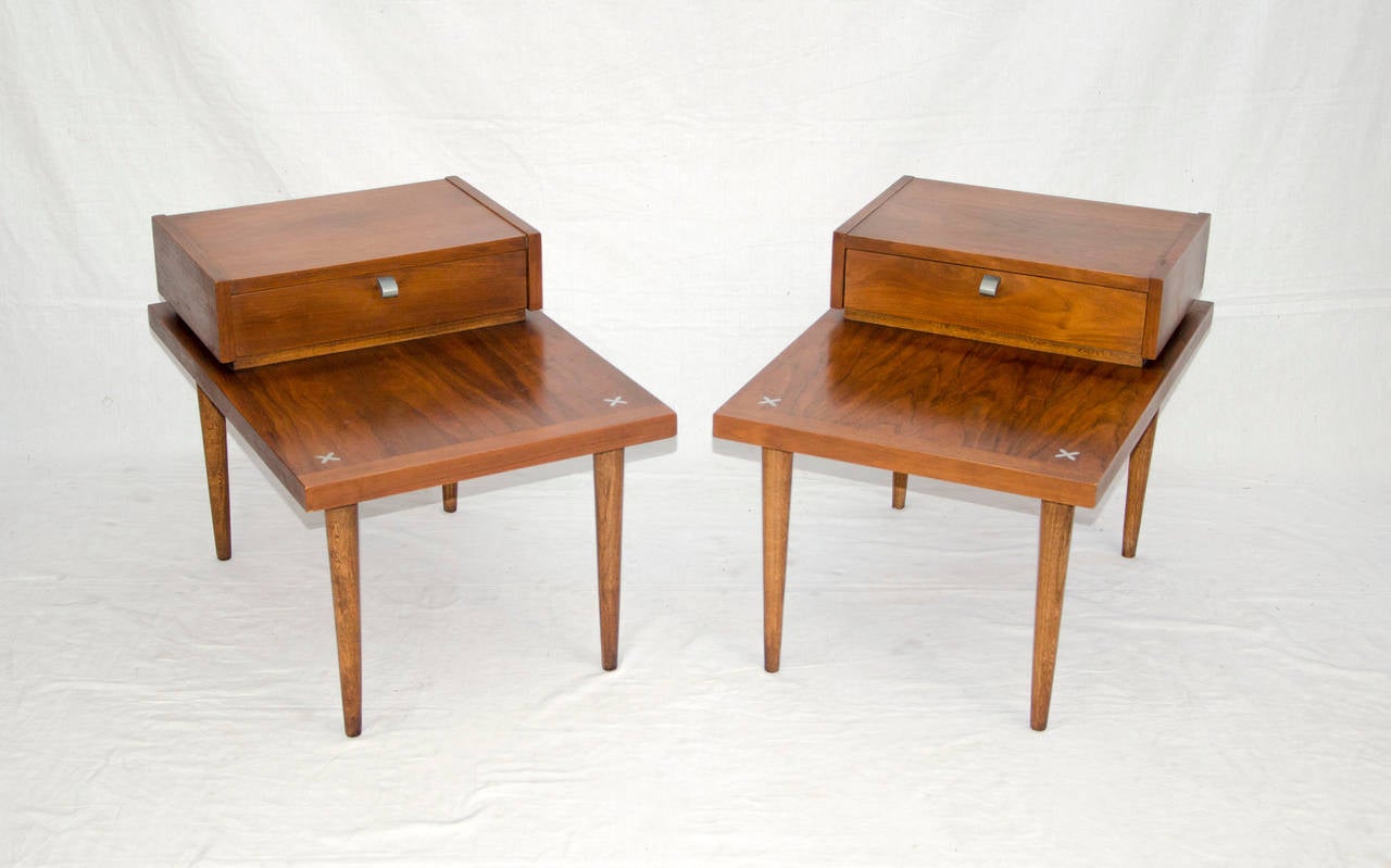 Nice pair of walnut end tables for use next to mid century sofas and chairs also works well as night stands. Very nice original finish. Company logo in each drawer.