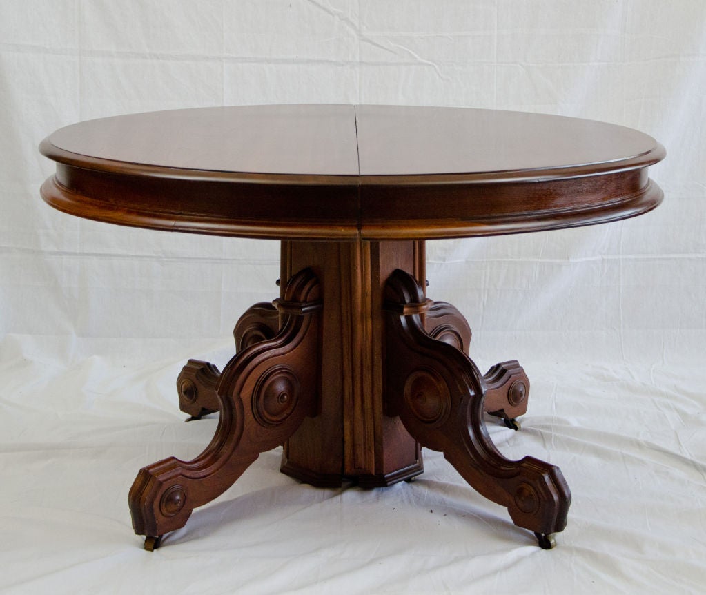 Nice medium size 19th century American Walnut Victorian dining table with two 14