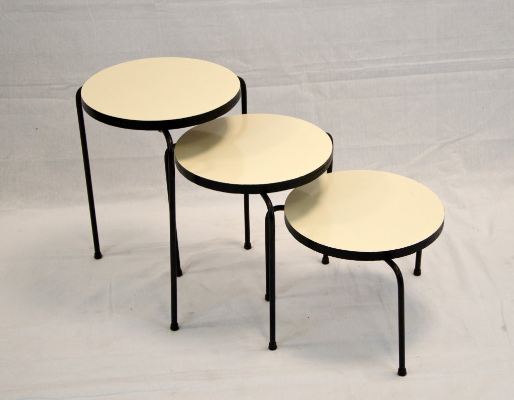 Set of three stacking/nesting side tables by Luther Conover.<br />
The heights of the tables are 19