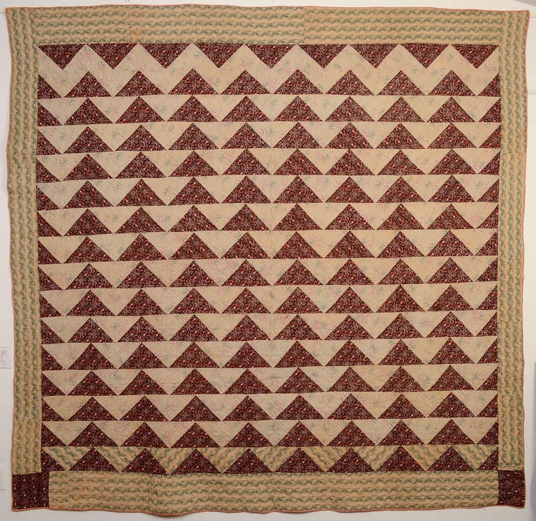 Richly colored Wild Goose Chase quilt (aka Geese in Flight) from the early 19th century. Abutting the triangles gives a terrific up and down movement to the 
