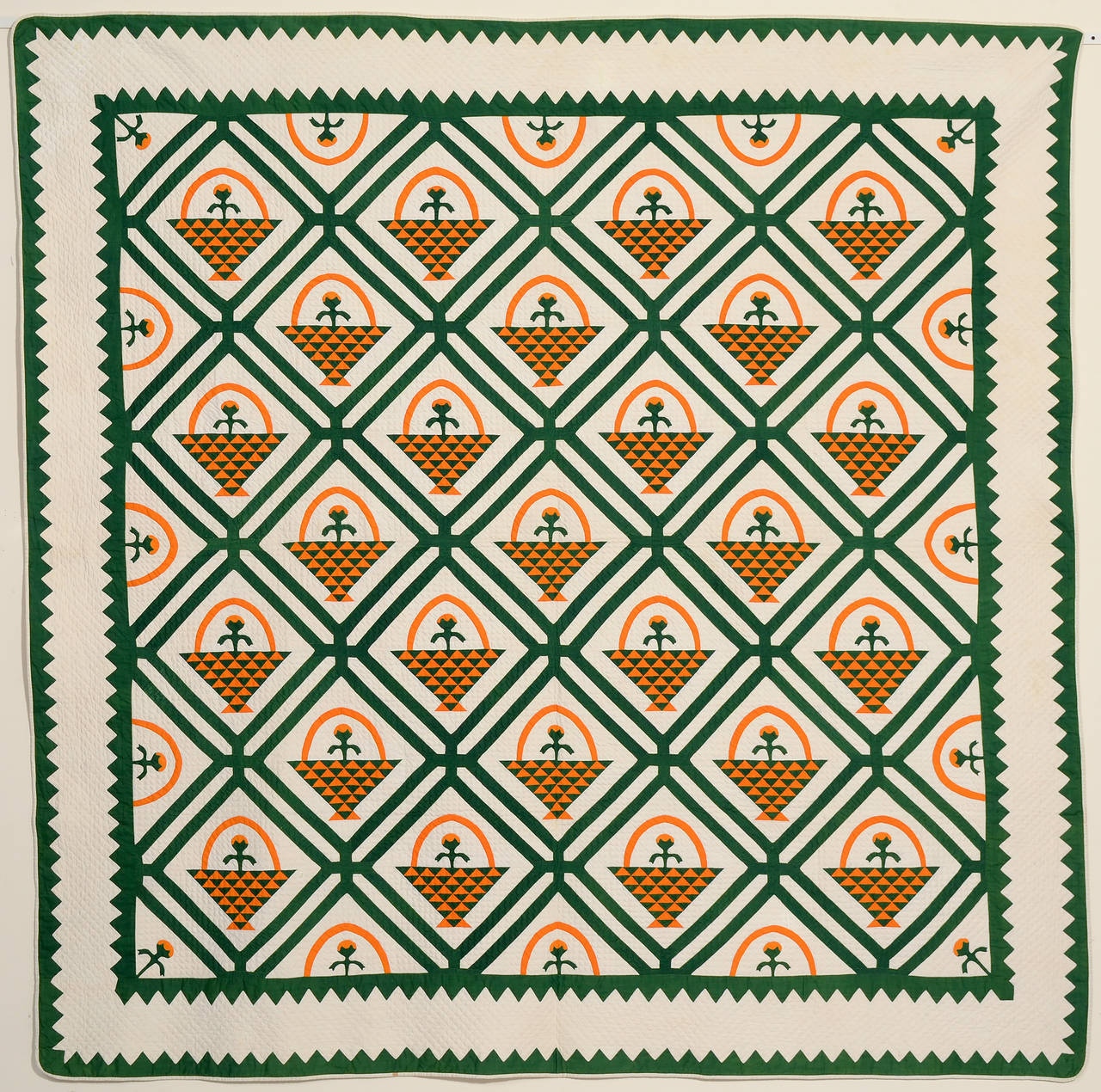 Everything about this multipatterned flower basket quilt is intensely detailed. The triangles forming the baskets are extremely finely pieced. It is very well quilted with small diamond patterning throughout. One wonders whether the maker chose the