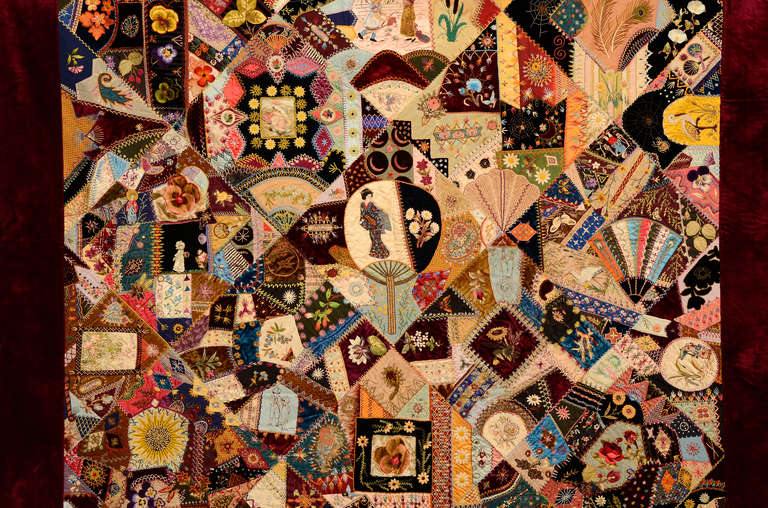 This extraordinary Victorian Crazy Quilt has the most elaborate embroidery I have seen. The center is a Japanese fan with the figure of a geisha within it. 
Additional images include: other people; birds, flowers,moon and stars  all done with the