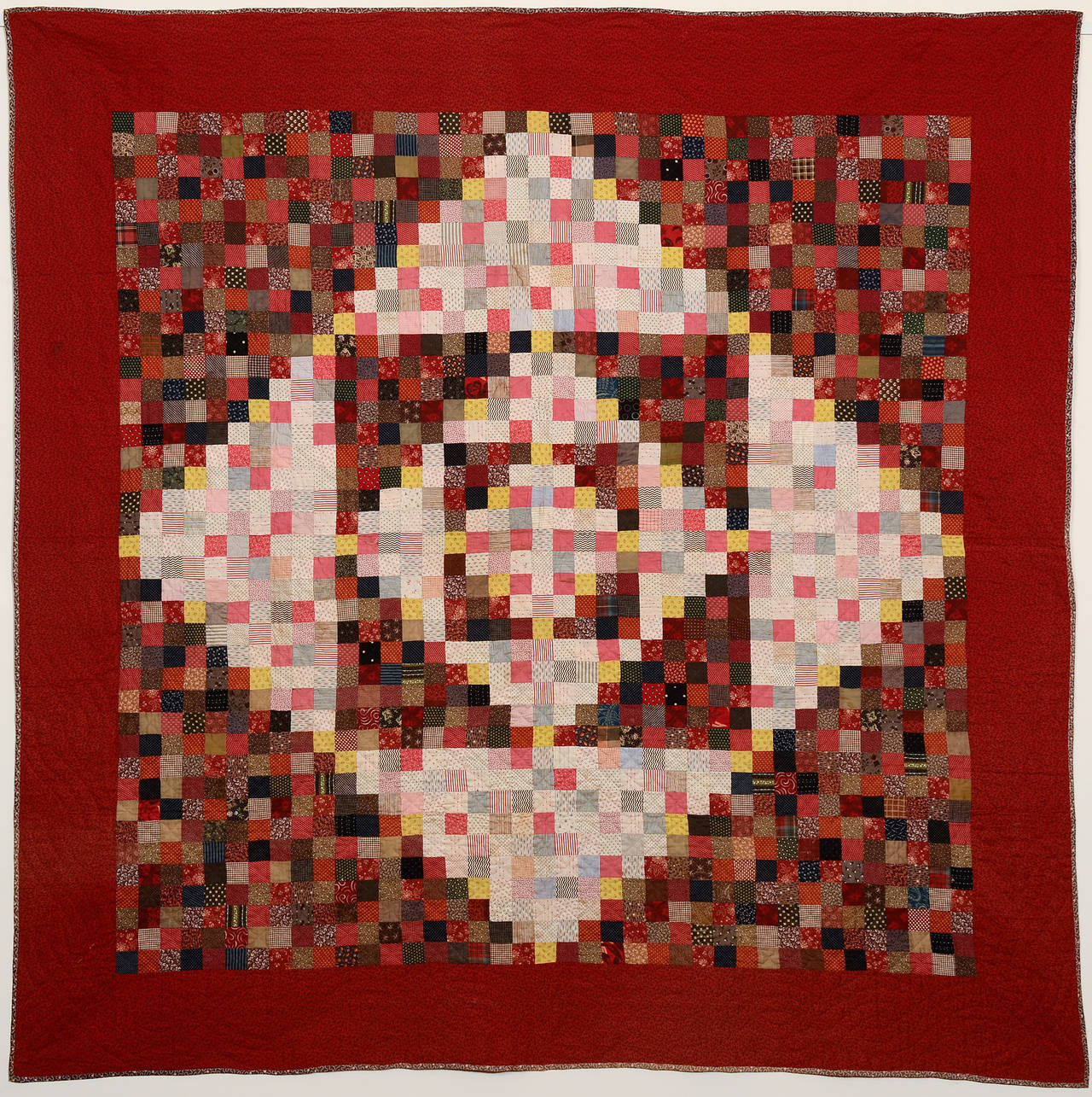 This diamond in a square quilt is created with the use of one patch blocks. It is an unusual variation from Bowmansville, a small town in Lancaster, Pennsylvania known for its Star pattern quilts made in this manner. The light and dark calico