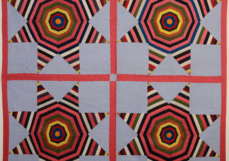Bold String Stars (aka Spider Stars) quilt done in the fabrics typical of southeastern Pennsylvania in the late 19th century. The blue calico ground and double pink sashing and border scream Lancaster County. Solid colors used in the center of the