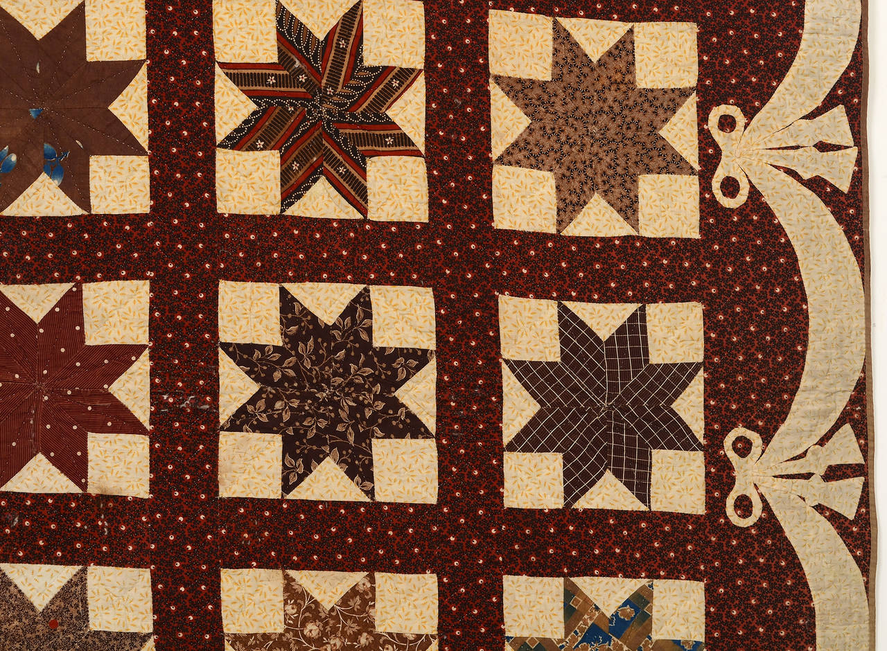 Patchwork Lemoyne Stars Quilt with Swag and Bow Border