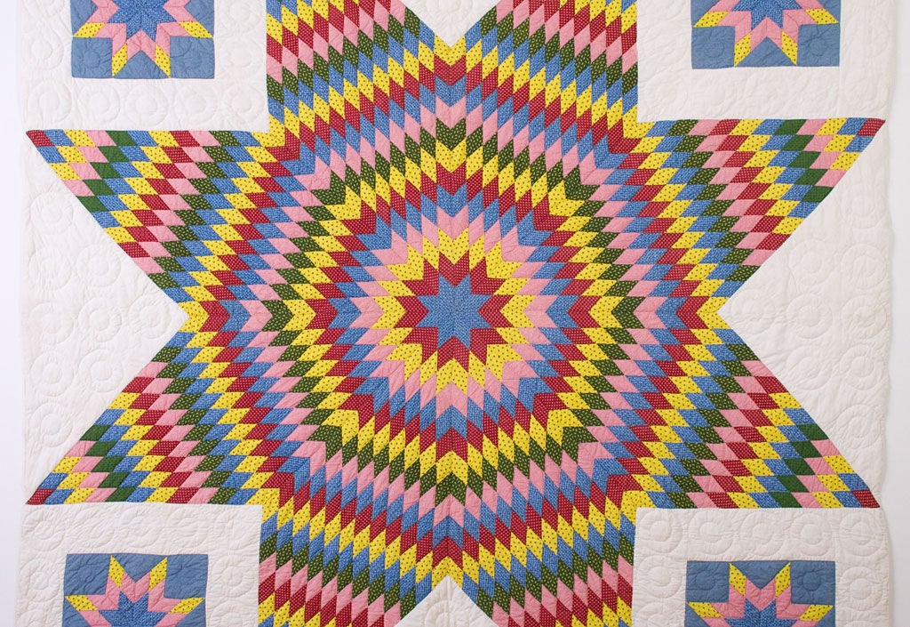 Dramatic Star of Bethlehem Quilt (aka Lone Star or Texas Star) with beautiful printed fabrics on a solid white ground.<br />
Surrounding stars set in squares are an unusual variation. Quilted mostly with patterns of circles that are a nice