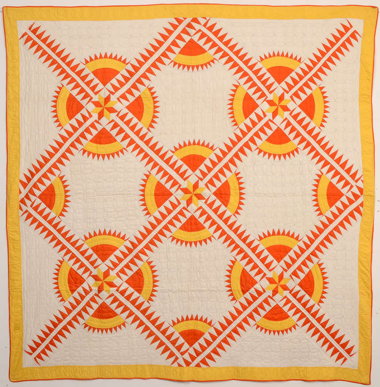 This is a particularly fine example of the desirable New York Beauty pattern. The colors really seem to give off the glow of sunshine. It is well quilted with overlapping circles that are a terrific complement to the round pieced pattern. The New