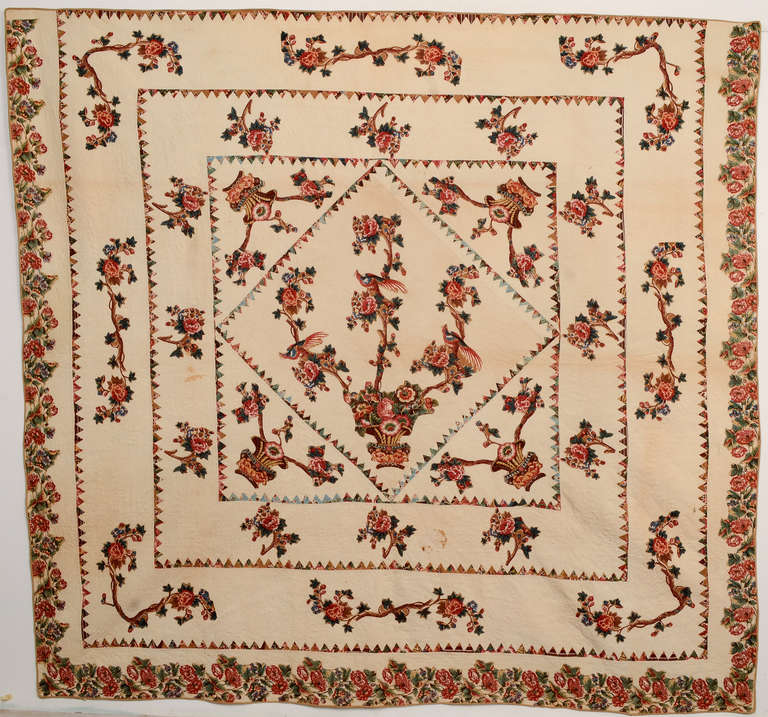 Beautifully balanced, classic center medallion Tree of Life Broderie Perse quilt. An elaborate bird is perched on each arm of the central tree. Four 