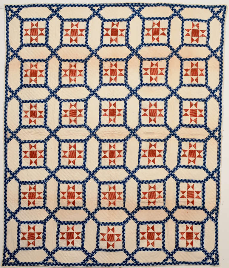 This indigo Garden Maze quilt is highlighted with an Evening Star in the center of each block. The two very geometric patterns, as well as their colors, blend well. Quilted with diagonal lines. It is in excellent, unwashed condition. Measurements