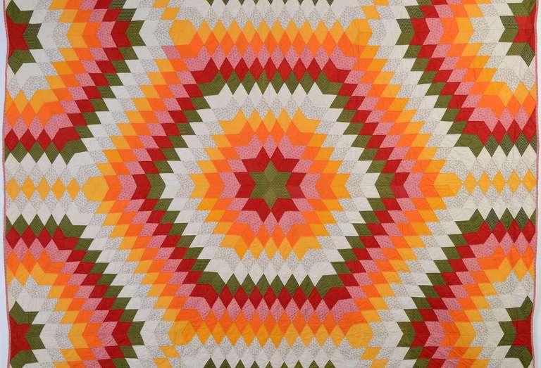 Both the pattern and colors make this Starbursts quilt totally dynamic. It is made of a combination of solid and printed late 19th century fabrics. Measurements are 74