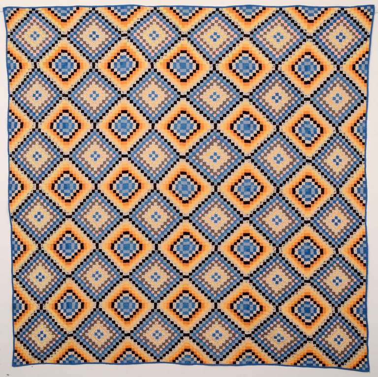This fine Philadelphia Pavement quilt is done with smaller than postage stamp size pieces for a total of 12,996! The maker took as much care with her color choices as with the piecework. It is an unusual and very effective color palette. This quilt