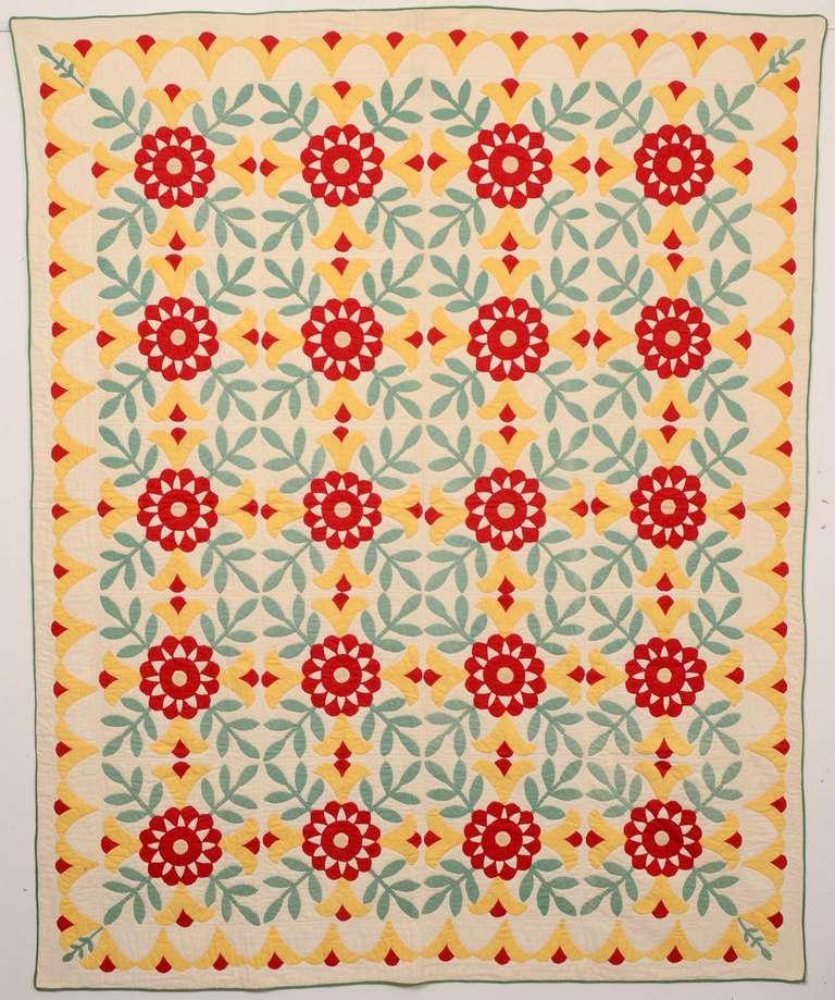 This robust floral applique quilt is a blue ribbon winner from the Indiana State Fair in Indianapolis in 1935. On the back of the ribbon is printed