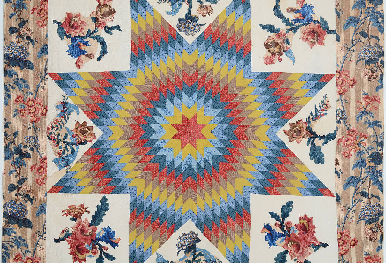 Glorious is the best way to describe this lone star quilt with chintz border and applique (broderie perse). The colors are as vibrant as the day it was made in the 1830s. It is finely stipple quilted with diagonal lines. The quilt is in excellent,