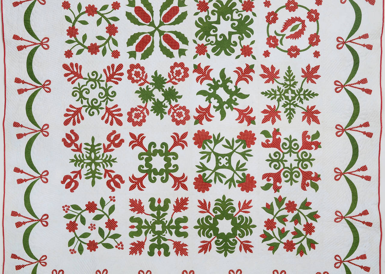 This wonderful floral album quilt is a combination of traditional and original appliqued blocks. Many of the original ones are done with reverse applique and look very much like the scherenschnitte paper cutouts popular with Pennsylvania Germans.