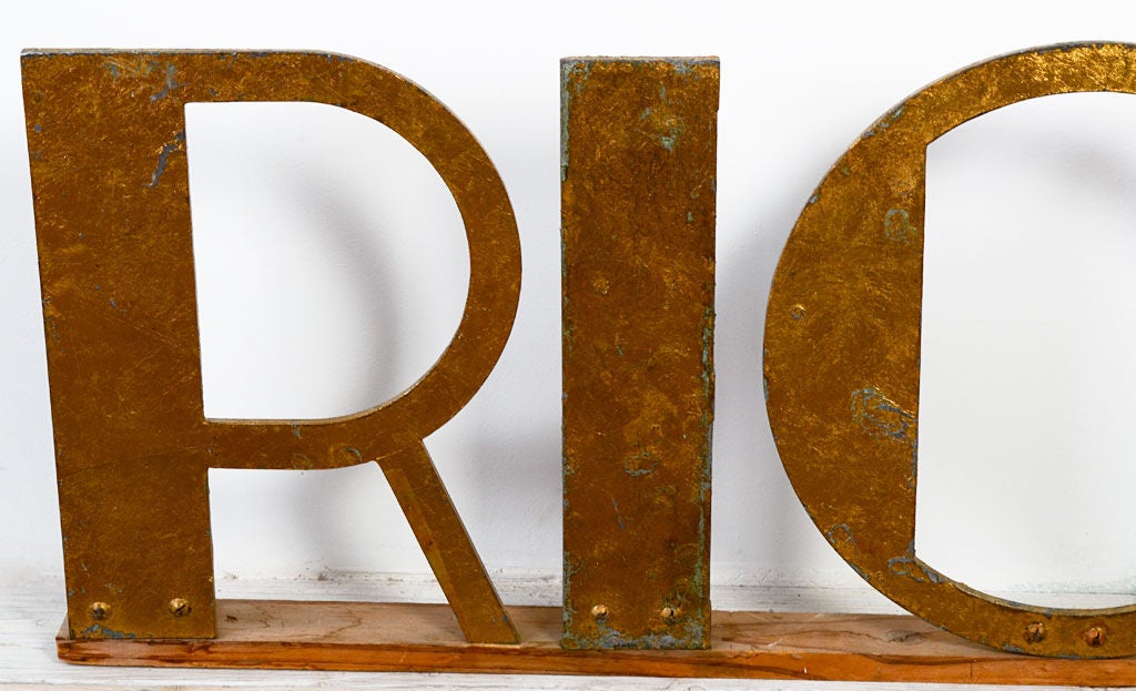 This seemingly straightforward sign is open to several interpretations. Is it a statement of aspiration or having arrived? Might it be Richard's nickname? In any case, it is wonderful decoration from the 1930's. Letters are metal with nicely
