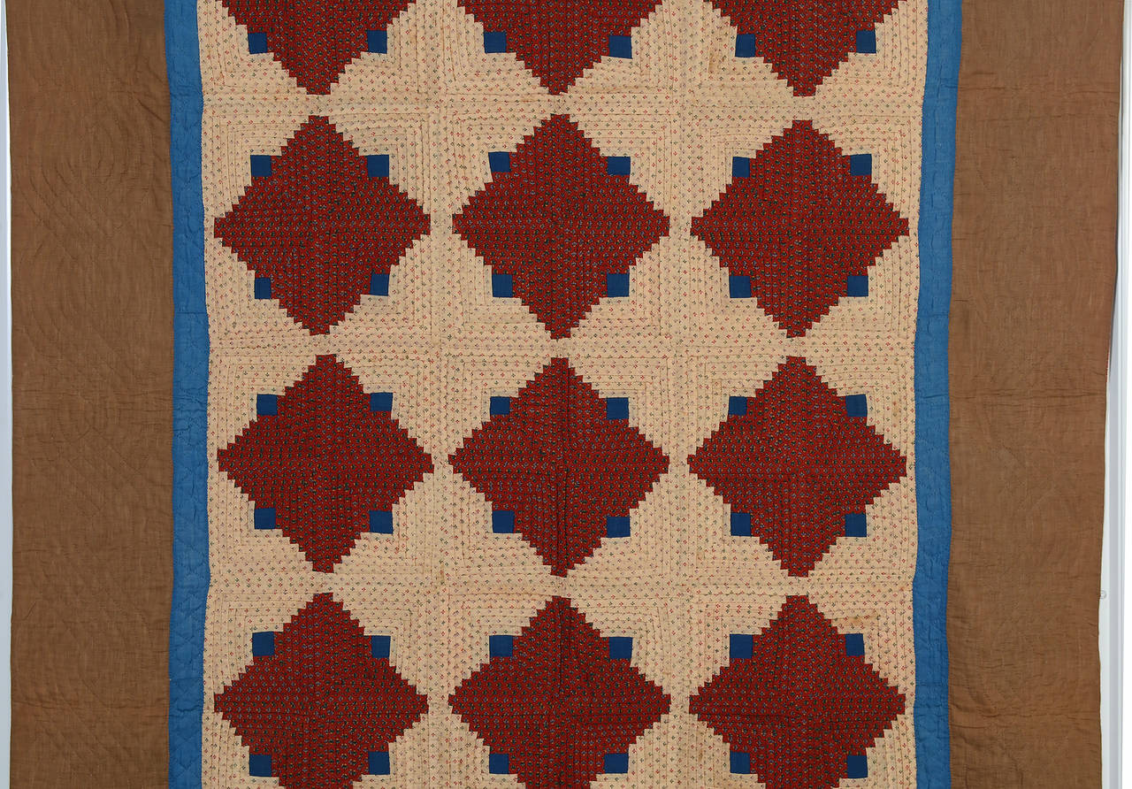 This light and dark wool challis log cabin quilt is done with unusually light tones. A note pinned to the quilt explains that the fabrics were from two dresses of the maker, Louisa Dreibelbis. One can only assume they were among her favorites. While