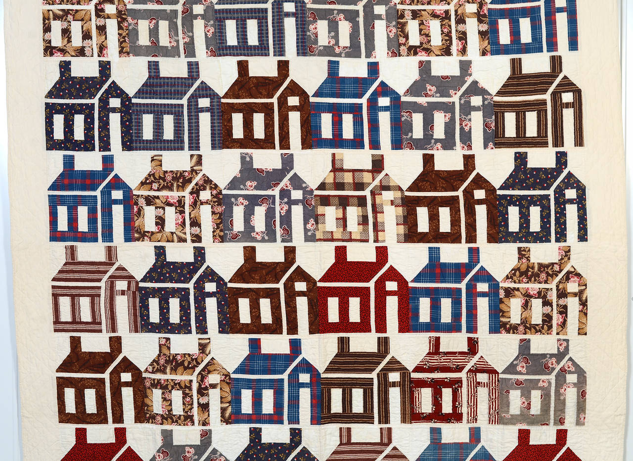 The densely packed buildings give this Schoolhouse quilt an abstract quality. Rarely does one see the buildings abutting one another as they are in this example. It is interesting to see how the buildings are created almost entirely of a variety of